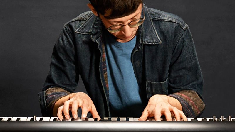 Person playing an electric piano.