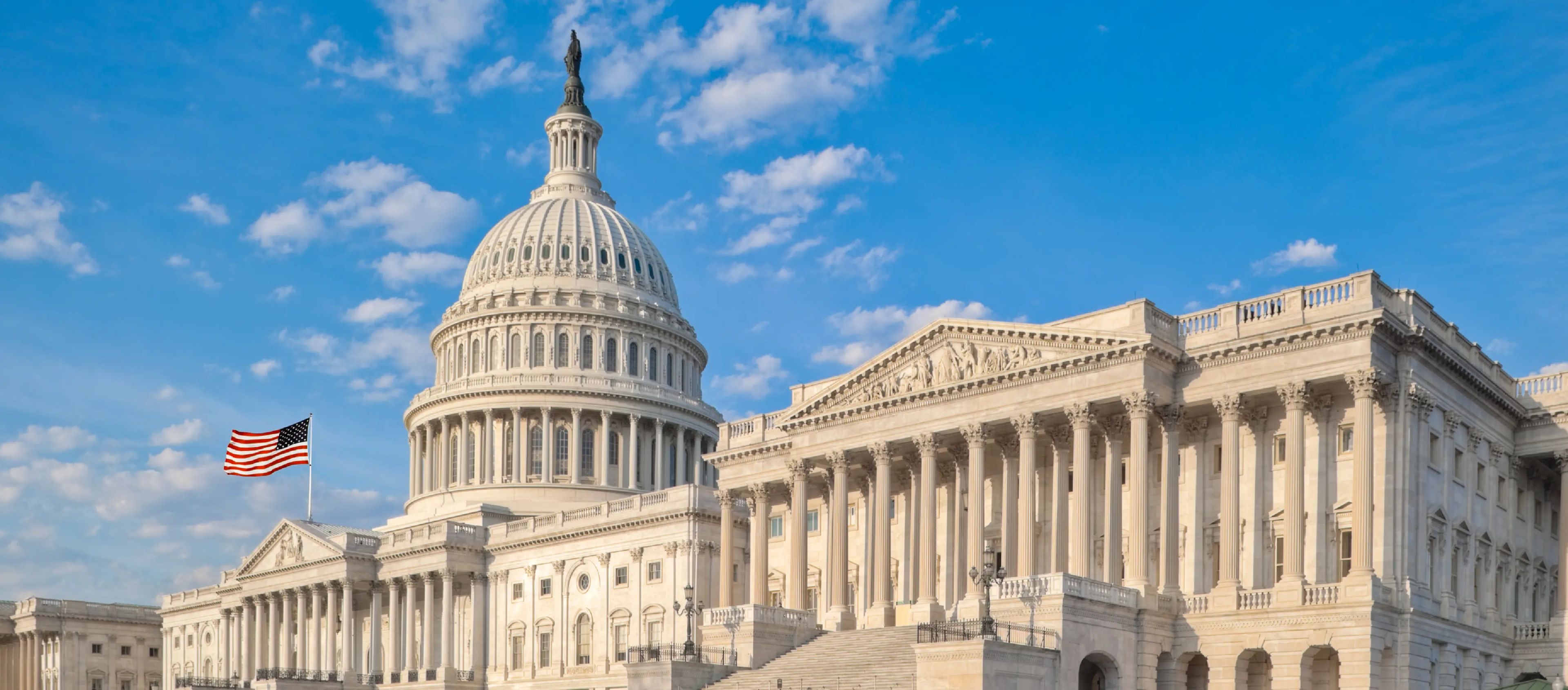 United States Capitol building, a prominent architectural landmark with a large dome and numerous columns.