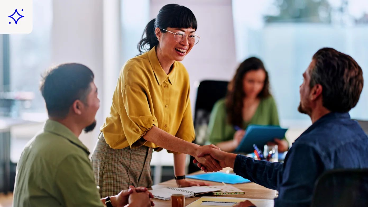 group of people are gathered around a table.