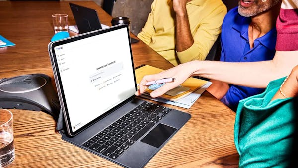 group of professionals looking at G-P Gia on a laptop