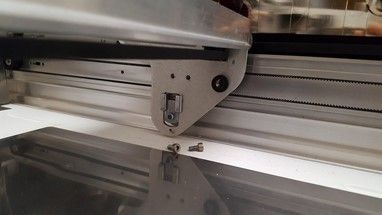 belt clamp in position behind the side of the laser arm