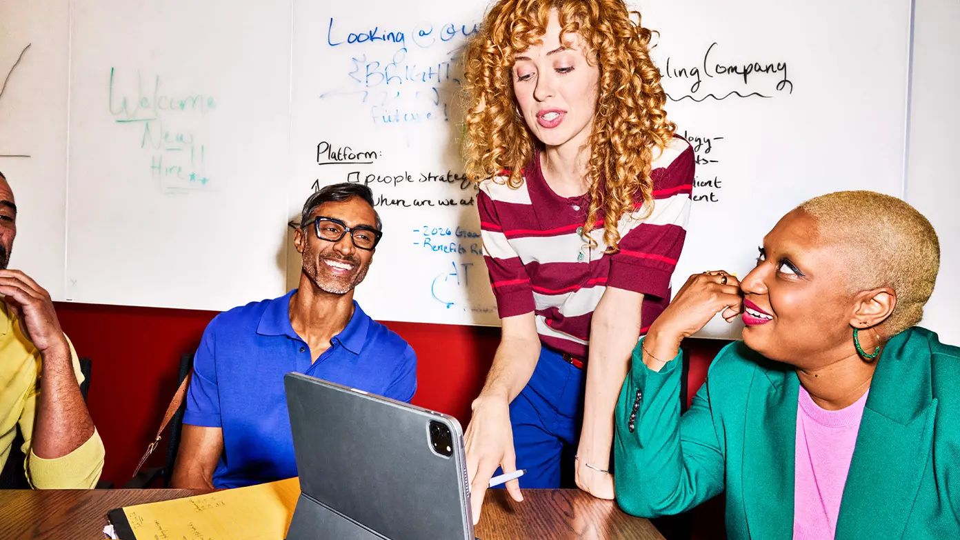 group of business professionals discussing a project