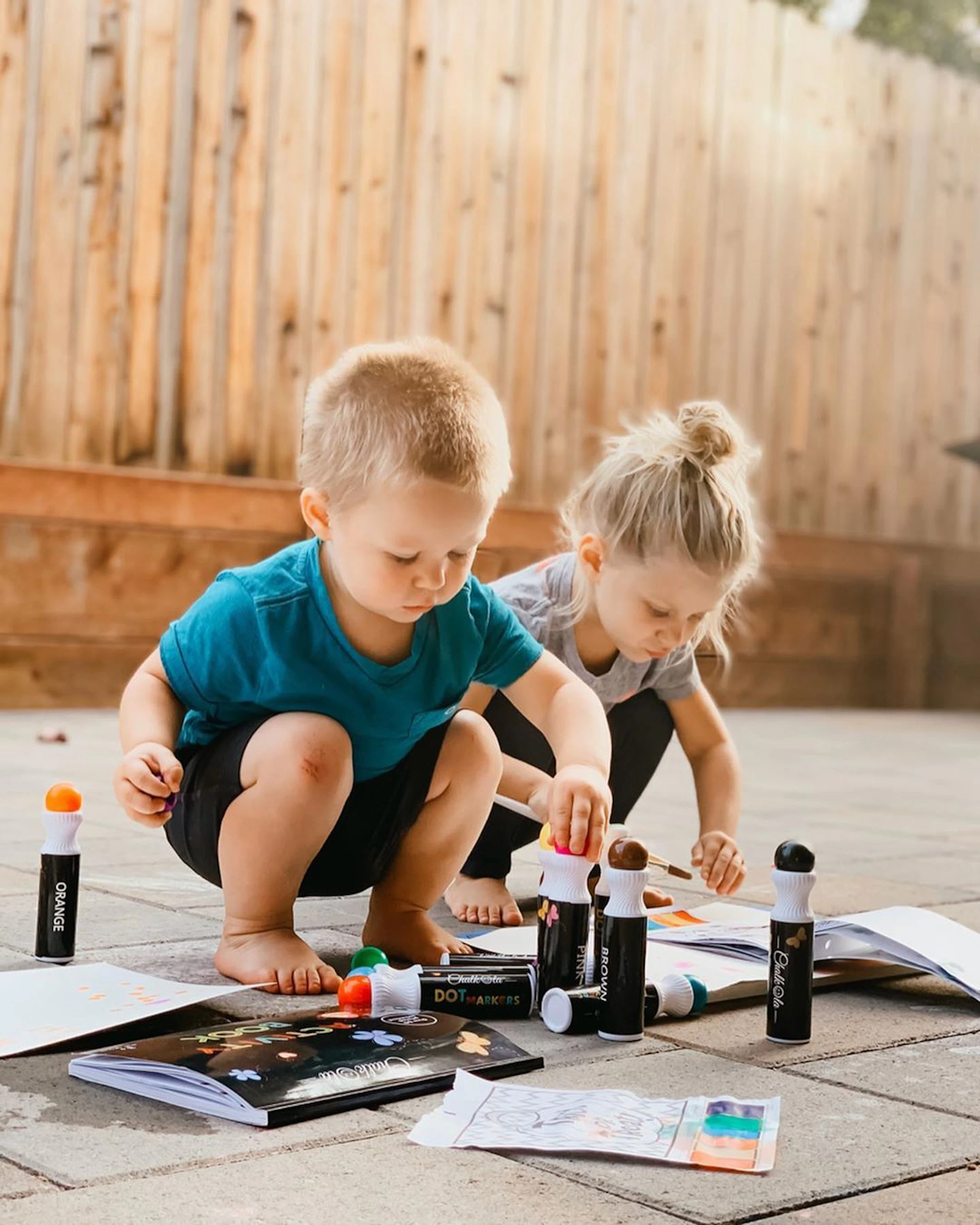 Kids using dot markers for alphabet and number learning