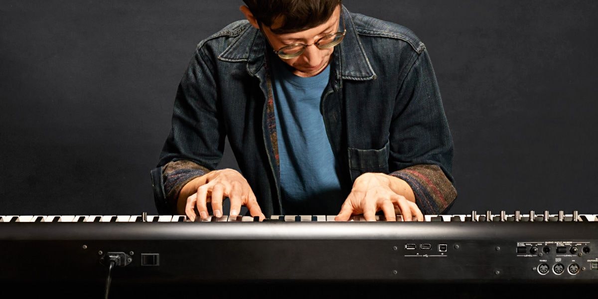Person playing an electric piano