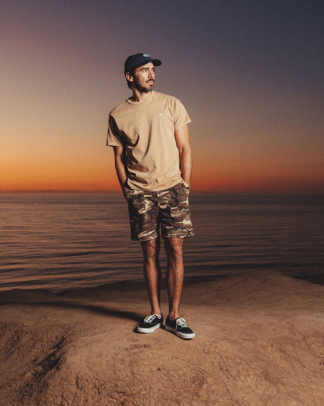 Spring is a State of Mind: Surplus in Paradise Men's Neutral Tee and camo shorts