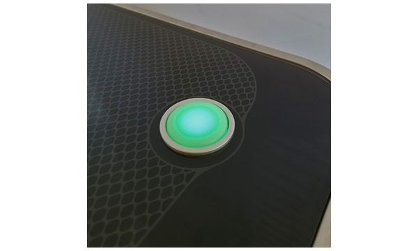 The Glowforge button glowing green