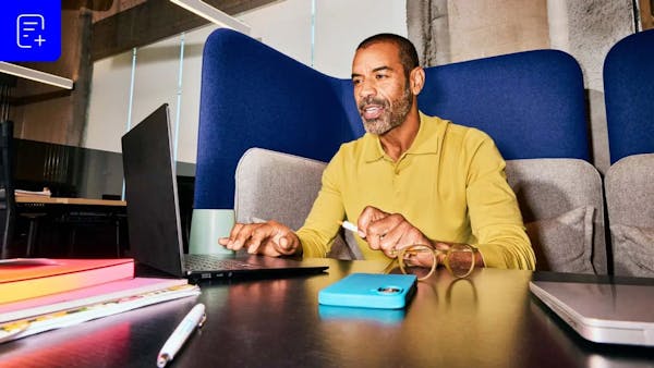 man sitting in a modern office environment