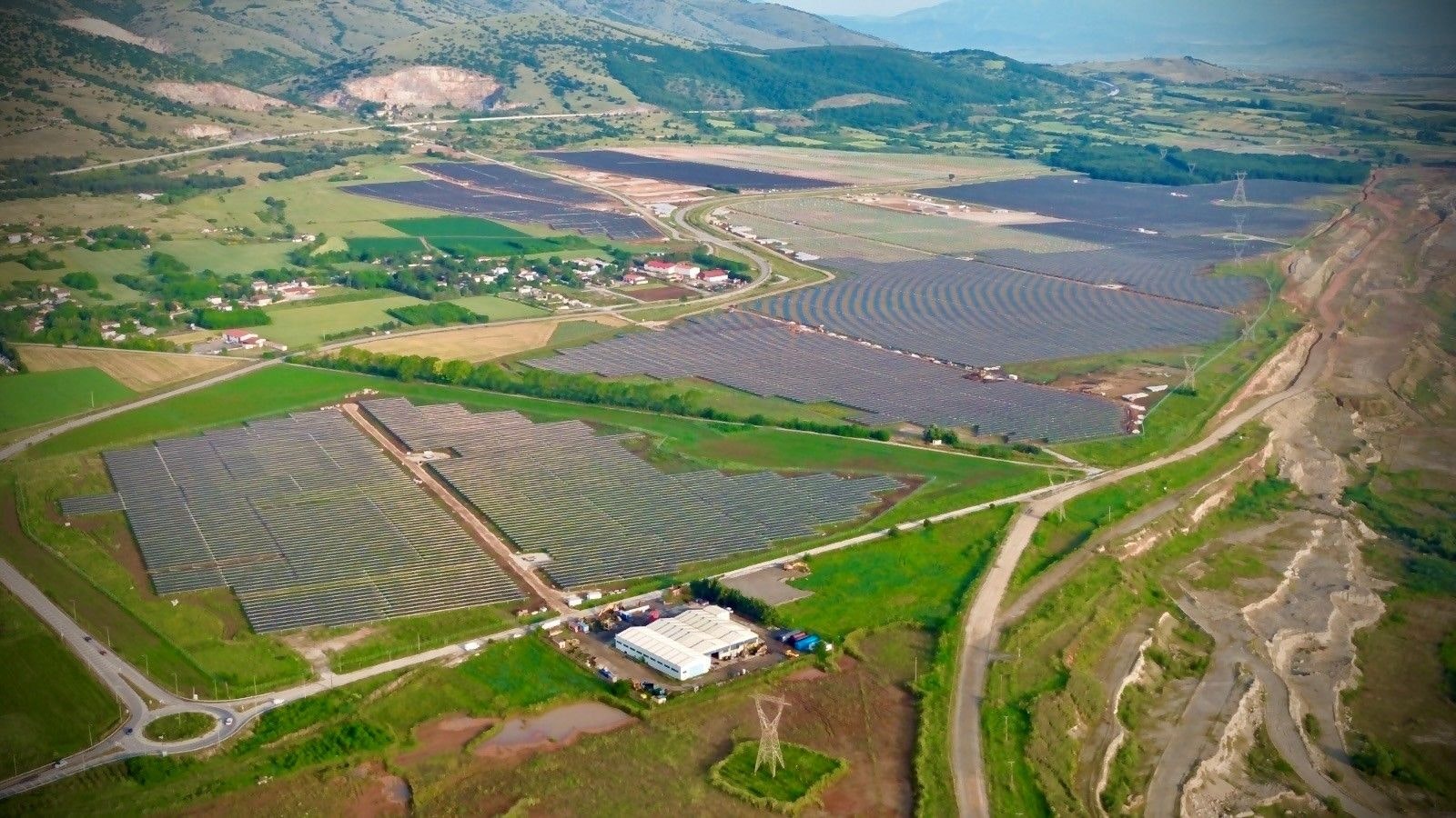 Image Attributed to: Nextpower. Aerial view of a the Ptolemaida solar project. 
