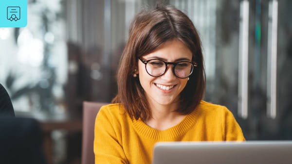 Smiling woman on work laptop
