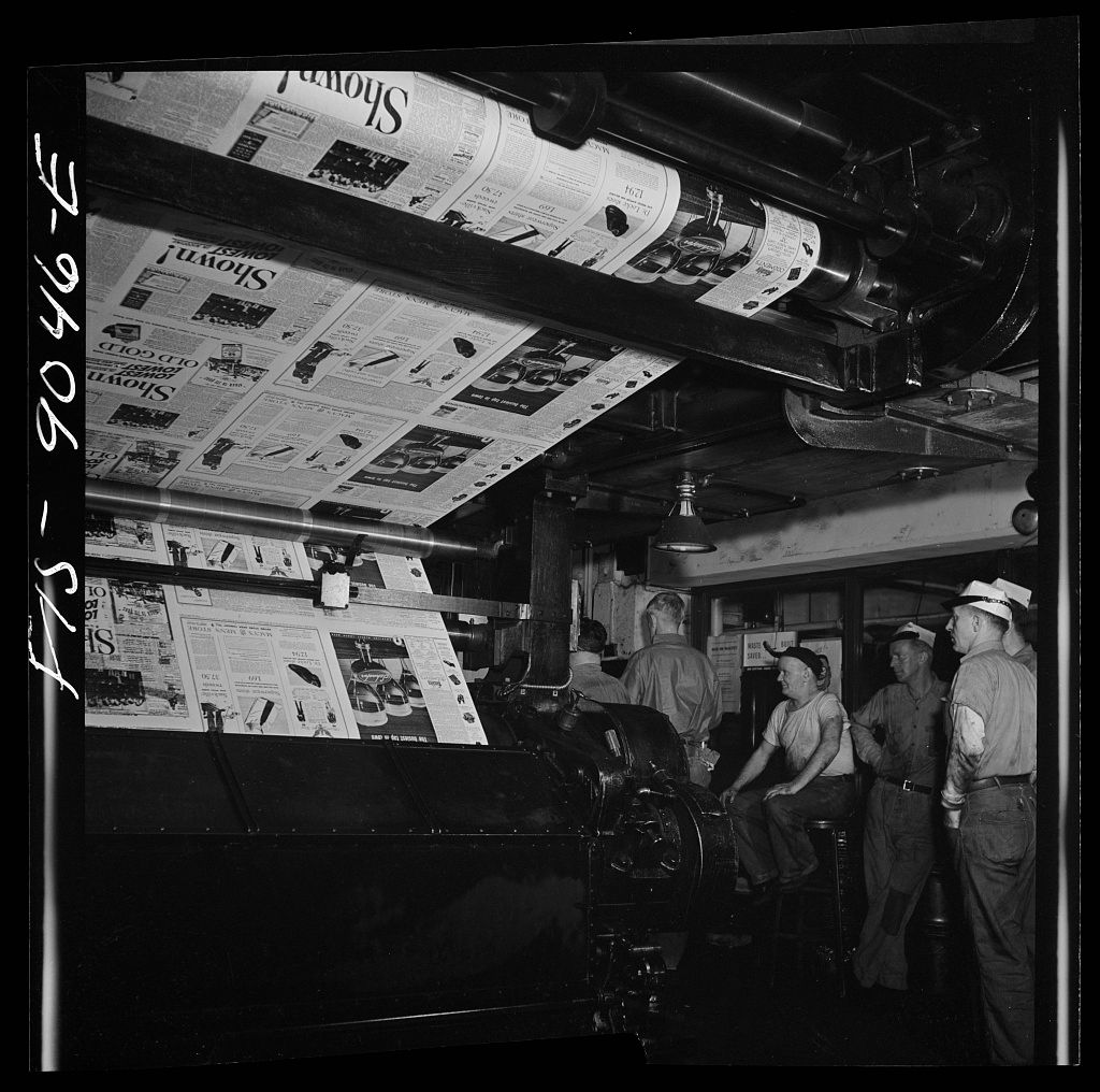 Pressmen watching pages run through the presses at The New York Times, 1942