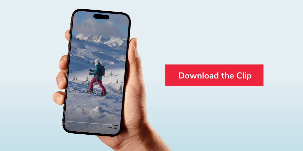 Hand holding a smartphone with a video of a skier on it, next to a red button that says "Download the Clip."