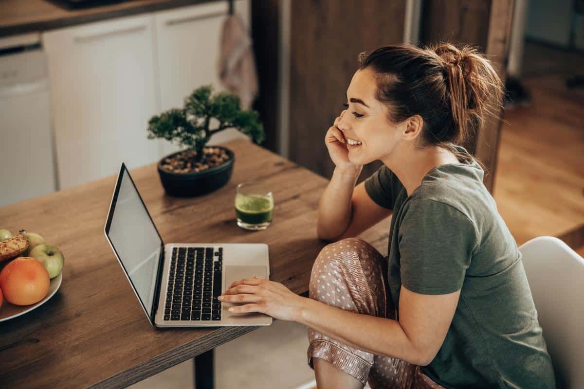 woman working on project looking at laptop