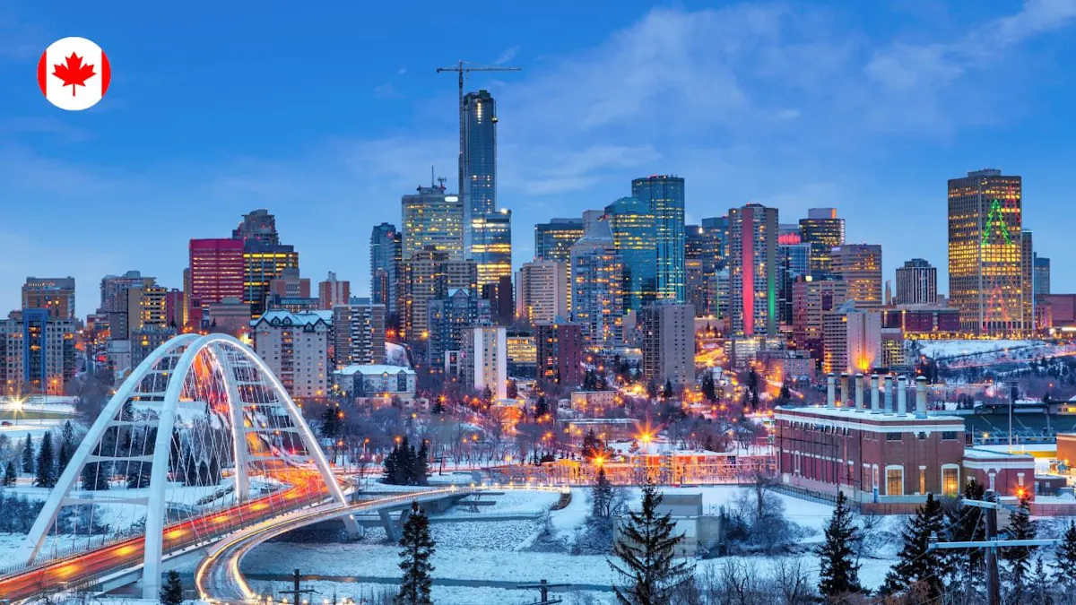 Edmonton city skyline in winter at dusk, featuring the illuminated Walterdale Bridge and skyscrapers.