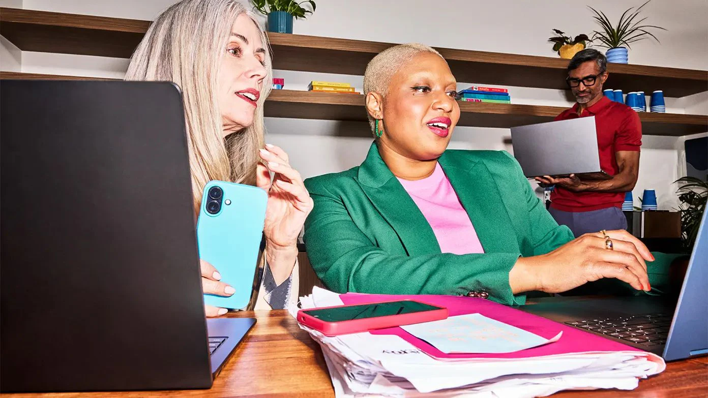 business professionals working on laptops in an office