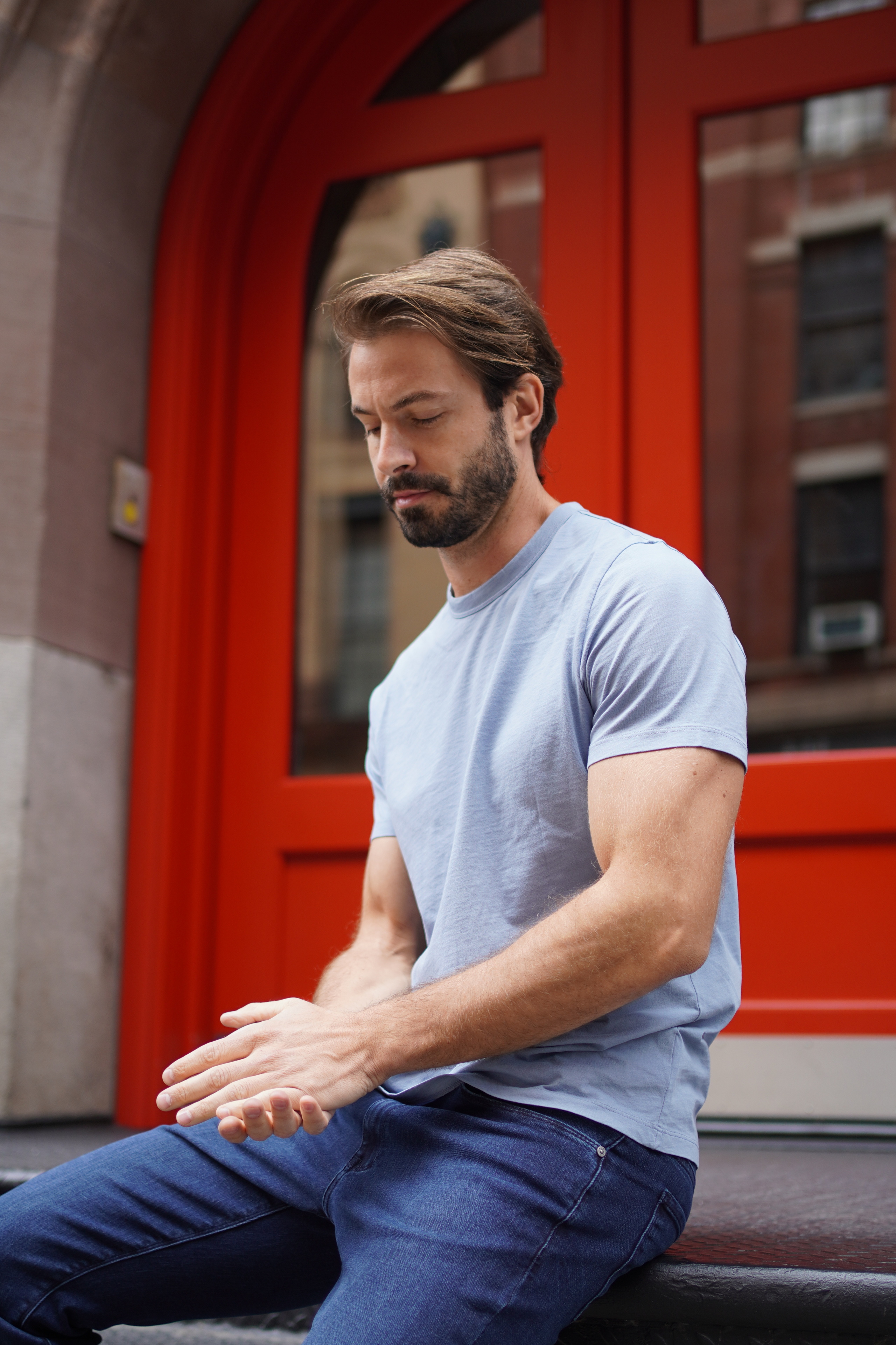 Man in a Tech Tee and jeans in the city