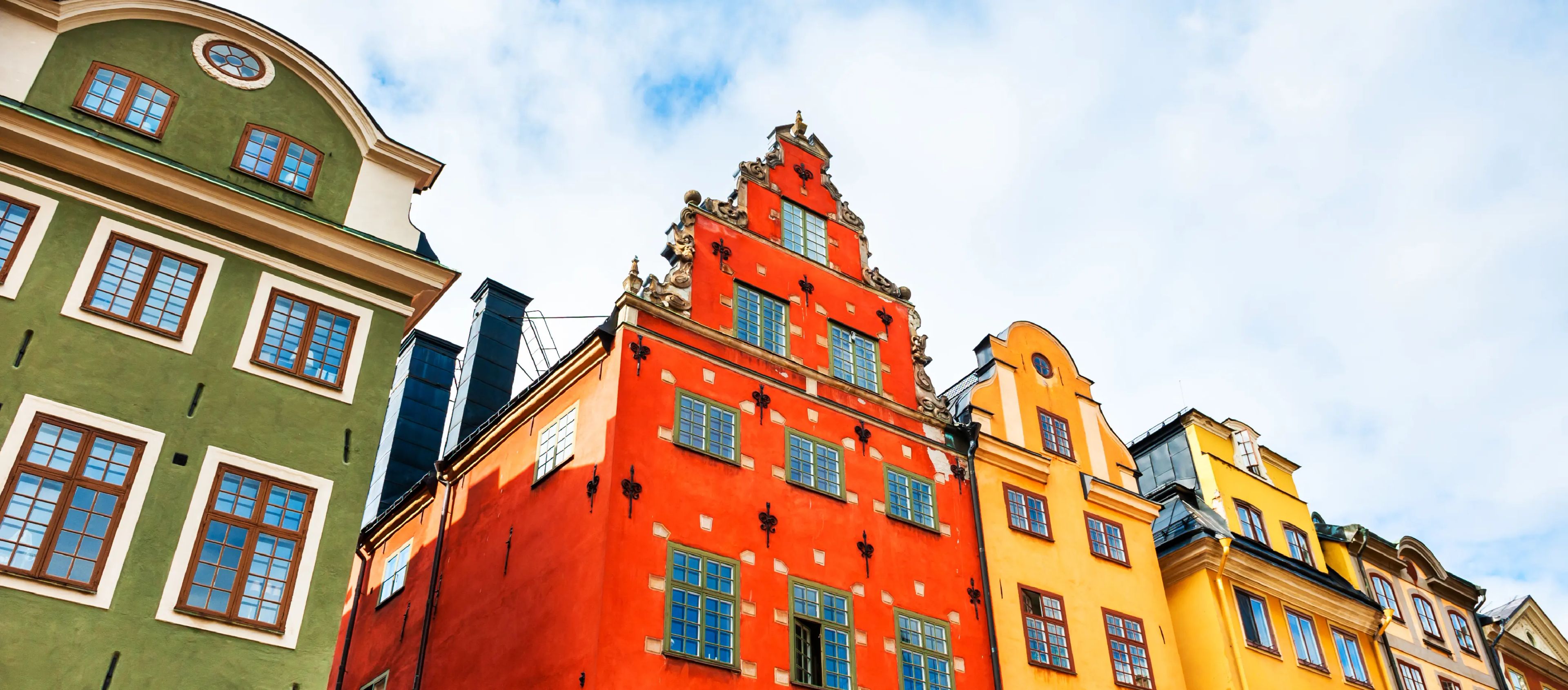 Colorful historic buildings in Gamla Stan, Stockholm, featured in a guide to hiring and recruiting talent in Sweden.