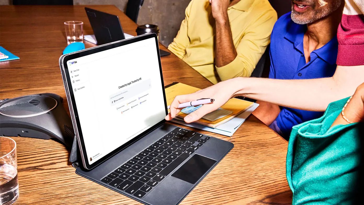 business professionals looking at tablet and using G-P Gia™